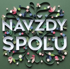 the words navzddy spolu are cut out of paper and decorated with flowers