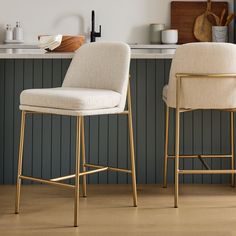 two stools sitting next to each other in a kitchen