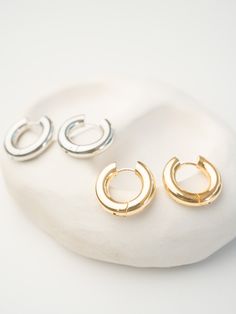 The Chubby Hoops are funky, chunky and fabulous and are the perfect everyday statement pair of earrings. They’re simple, sturdy and elegant. Once on they sit perfectly against the ear for a clean and sharp look. 2cm diameter and 4mm thickness 18k gold-filled and silver options Hypoallergenic and nickel free. waterproof and tarnish resistant Bixby and Co Jewellery - wearable sunshine Chic Chunky Hoop Earrings For Everyday, Chunky Metal Hoop Earrings For Everyday, Everyday Chunky Metal Hoop Earrings, Modern Chunky Hoop Earrings For Everyday, Trendy Chunky Hoop Earrings, Everyday Chunky Hoop Earrings, Trendy Chunky Small Hoop Earrings, Gold Filled, 18k Gold