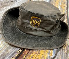 A must have for every UPS driver!! These Booney hats by Dri-Duck are perfect to keep that summer sun away!- 61/37/2 cotton/polyester/polyurethane, faux waxy canvas- Polyester mesh lining- Breathable- Brass mesh eyelets and snaps- Moisture-wicking sweatband- Suede adjuster on chin strapSize: One Size Fits Most - Hat Size: 7 1/2 - 7 5/8 Casual Bucket Hat For Summer Outdoor Work, Casual Summer Bucket Hat For Outdoor Work, Casual Bucket Hat For Outdoor Work, Casual Summer Hat For Outdoor Work, Outdoor Canvas Bucket Hat With Short Brim, Adjustable Casual Bucket Hat For Outdoor Work, Outdoor Brimmed Canvas Hats, Casual Curved Brim Hat For Outdoor Work, Outdoor Canvas Brimmed Hat