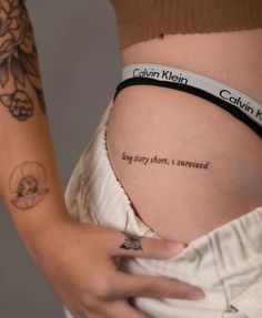 a woman's stomach with the words written on it and an inscription below her belly