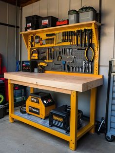 a workbench with tools on it and other items in the storage area below