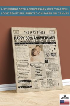 an old newspaper with the words happy 50th anniversary printed on it, next to a wooden floor