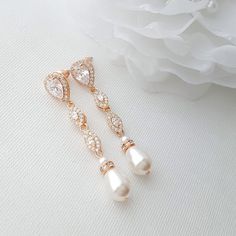 Delicate 14k Gold Plated Pearl Drop Wedding Earrings Wear these gold pearl drop earrings that are delicate and perfect for brides and their wedding day look, If gold drop earrings with pearls are your preference then these slim bridal gold earrings design must be definitely considered for their elegance. These pearl drop earrings are beautifully crafted with marquise design cubic zirconia in 14K gold plating. The pearl drop earrings naturally sway when you move. The drop earrings measure perfect Gold Pearl Drop Earrings, Silver Pearl Drop Earrings, Wedding Jewellery Designs, Pearl Drop Earrings Gold, Rose Gold Pearl, Silver Pearl Earrings, Pearl Earrings Wedding, Gold Bridal Earrings, Wedding Earrings Drop