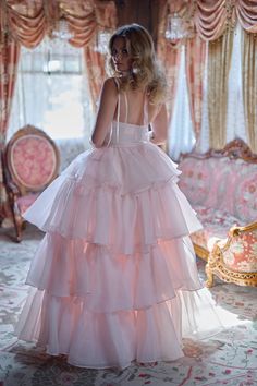 Embrace the wild beauty of the frontier in this enchanting two-piece ensemble. The slinky slip dress, adorned with a flirtatious bow-tied bust, pairs perfectly with a flowing tiered skirt. An extra-long satin ribbon closure adds a touch of frontier elegance. In a desert rose pink as tender as a cowboy's heart, this ensemble blooms with frontier charm. This is a two piece set. Two piece slip dress set with tiered maxi skirt Slip dress features a peek-a-boo cutout and underwire cups with a ribbon Pink Victorian Dress, Ruffle Maxi Skirt, Skirt Swimsuit, Princess Core, Puff Dress, Wild Beauty, Tiered Ruffle Skirt, Tiered Maxi Skirt, Girly Dresses