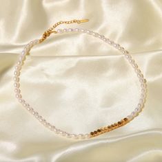 A beautiful strand of genuine pearls and geometric gold beads bring the perfect finishing touch to any outfit. Handcrafted by skilled artisans, these bracelets are true labor of love. Fresh water pearls symbolize purity, harmony and humility. Measurement: 15" length + 2" extender Handmade Genuine Freshwater Pearls 18K Gold Stainless Steel 100% Eco-Friendly; No Nickel, Chromium and Lead 💦 Water-resistant, sweat-proof, hypoallergenic and tarnish-free. You can work out in our durable jewelry, wear Gold Pearl Single Strand Beaded Bracelets, Minimalist Gold Pearl Beaded Necklace, Elegant Adjustable Pearl Necklace With Gold Beads, Adjustable Elegant Pearl Necklace With Gold Beads, Adjustable Pearl Necklace With Gold Beads, Gold Beaded Necklace With Pearl Charm, Adjustable Gold Beaded Necklace With Pearl Charm, Adjustable Pearl Necklace With Gold Beads As Gift, Adjustable Gold Pearl Beaded Necklaces