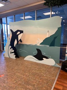 two orca killers on display in an office lobby