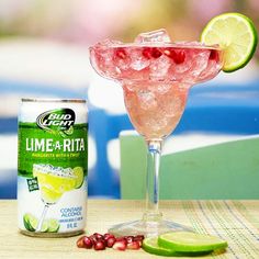 a can of lime - a - rita next to a drink with garnishes