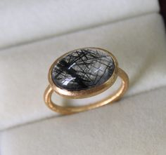 Handmade Black Rutilated Quartz Ring - Dainty Rutilated Gold Ring - Genuine Rutilated Birthstone Ring - Gift for Her  9K,10K,14k,18K,22K Stone Size  - 10x14 MM  Width - 1.70 mm   Gold Colour Options -  Yellow Gold, White Gold, Rose Gold  Ready to Ship 1-2 week Available  White, Yellow, Rose Gold ( also in 9K, 10K, 14K, 18K, 22K ) Customization is available, I also can make it with 9k,10k,14k,18k,22k solid gold (white or rose), and diamond accent stone, just feel free to contact me. Any questions Rutilated Quartz Ring, Quartz Jewelry, Quartz Ring, Rutilated Quartz, Birthstone Ring, Ring Gift, Rings Statement, Or Rose, Gold Color