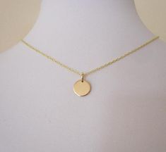 925 sterling silver or yellow gold small coin disc charm with chain necklace.Minimalistic charm necklace, simple and elegant.The yellow gold necklace is made with gold plated sterling silver chain and a gold filled disc.The sterling silver necklace is made with 925 sterling silver chain and a sterling silver disc.The charm is 9mm (0.35") in diameter The necklace comes bubble wrapped and gift wrapped in a complementary organza bag. Delicate Yellow Gold Coin Pendant Necklace, Minimalist Sterling Silver Coin Necklace With Delicate Chain, Delicate Yellow Gold Round Disc Necklace, Minimalist Round Disc Jewelry With Coin Pendant, Circle Charm Necklace In Yellow Gold Sterling Silver, Simple Gold Round Necklace, Minimalist Yellow Gold Initial Pendant Coin Necklace, Simple Gold Round Pendant Necklace, Minimalist Initial Pendant Coin Necklace