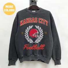 Perfect sweatshirt for Kansas City football fans this season! Ideal for any situation, a unisex heavy blend crewneck sweatshirt is pure comfort. These garments are made from polyester and cotton. This combination helps designs come out looking fresh and beautiful. The collar is ribbed knit, so it retains its shape even after washing. There are no itchy side seams on these sweaters.  .: 50% cotton, 50% polyester .: Medium-heavy fabric (8.0 oz/yd² (271.25 g/m .: Loose fit .: Sewn-in label .: Runs Fan Apparel Crew Neck Sweatshirt With Team Name, Crew Sweatshirt With Screen Print For Sports Season, Crew Neck Sweatshirt With Team Logo For Fans, Sports Fan Sweatshirt With Crew Neck, Letter Print Crew Neck Hoodie For Fans, Fan Merchandise Letter Print Crew Neck Hoodie, Winter Crew Neck Sweatshirt For Sports Fans, Football Season Crew Neck Sweatshirt With Team Logo, College Team Logo Hoodie With Crew Neck