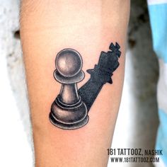 a black and white tattoo of a chess piece