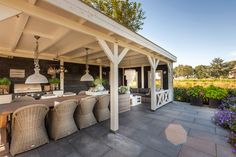 an outdoor kitchen and dining area is shown