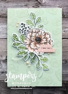 a card with flowers on it and the words stampers workshop written in white ink