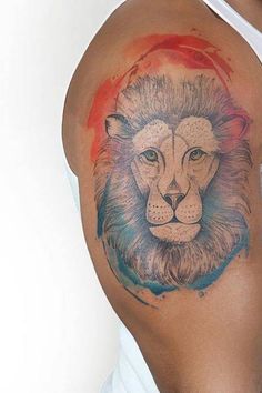 a man with a lion tattoo on his arm