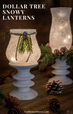 two white candle holders with pine cones on them and the words dollar tree snow lanterns