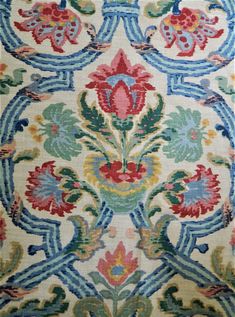 an old rug with colorful designs on it