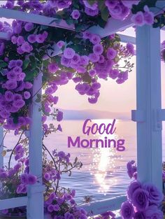 the words good morning are surrounded by purple flowers and hanging over an open window with water in the background