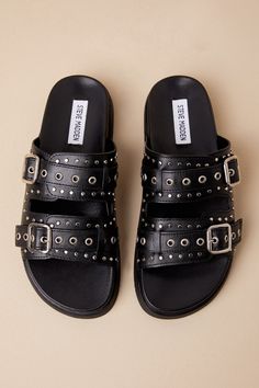 Finish off a stylish OOTD with an effortlessly edgy look like the Steve Madden Melanie Black Leather Buckled Slide Sandals! Smooth genuine leather shapes these elevated sandals with an almond footbed and two, wide adjustable straps embellished with silver grommets, rivet studs, and functional buckles. The easy slide-on design makes these the perfect pick for everyday styling. 0. 75" rubber heel. Cushioned insole. Rubber sole has nonskid markings. Genuine leather upper, balance man made materials Lulu Fashion, Sandal Heels, Edgy Look, Leather Buckle, Rubber Heels, Fit Inspo, Cute Shoes, Slide Sandals