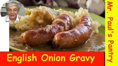 a green plate topped with two sausages covered in gravy