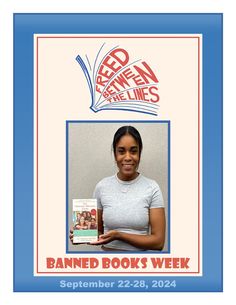 a woman holding up a book in front of a sign that reads banned books week