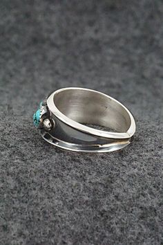 This turquoise and sterling silver ring was made by Navajo silversmith Paul Largo. The inside is stamped sterling.Size: 11.5Length: 3/8"Free shipping on all orders! We ship with USPS and always include tracking. All orders ship within a day of payment.Returns are accepted up to 30 days after you receive your order. Just send us a message. Our shop offers cash back or store credit. The item must be returned in new condition. Sterling Silver Turquoise Rings With Concho Detail, Southwestern Sterling Silver Turquoise Ring For Anniversary, Sterling Silver Turquoise Ring With Concho, Silver Turquoise Concho Ring In Sterling Silver, Native American Jewelry, Turquoise Sterling Silver, Free Jewelry, Sterling Silver Ring, Silver Ring