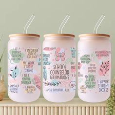 three pink mason jars with words on them