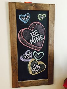 a chalkboard with hearts and the words be mine written on it next to a teddy bear