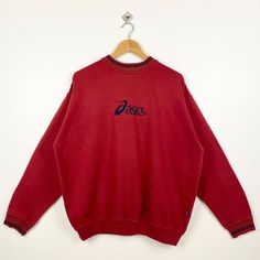 Vintage Asics Crewneck Sweatshirt Embroidery Logo Red Color Men's XL - Made in China - Materials : Cotton, Polyester  - Tag Reads : XL Kindly see the actual measurements (All measurements were taken lying flat) - Actual size manual measurements * Width (Armpit to armpit) : 26 inches * Length (Shoulder to end of garment) : 27 inches * Sleeve length : 24 inches - Condition : * Vintage condition 9/10 (90%) * Free from stain, tear and major defect - Shipping : * DHL Express/FedEx Express = 3-6 busin Red Crew Neck Top With Embroidered Logo, Red Crew Neck Sweatshirt With Embroidered Graphics, Red Long Sleeve Top With Embroidered Logo, Casual Red Embroidered Sweater, Casual Red Sweatshirt With Embroidered Graphics, Red Embroidered Crew Neck Sweater, Red Tops With Embroidered Logo For Fall, Red Long Sleeve Sweatshirt With Embroidered Graphics, Casual Red Embroidered Sweatshirt