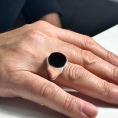 Silver Onyx Ring , Black Onyx Ring , Round Minimal Onyx Ring , Solid Signet Onyx Ring , Men Handmade Signet Ring , 925k Sterling Silver ★Item Details * Gender : Male / Female * Material : 925K Sterling Silver * Total weight : 15 Grams * Gemstone : Onyx Stone ✔ Ready to Ship in 1-2 Business Days .. ✔ Shipped to the Worldwide 1-5 business days with free shipping... ✔ The product will be sent to you with a handmade wooden box to avoid any damage during shipping... ✔ Visit our store, browse other Me Minimalist Silver Onyx Signet Ring, Modern Black Sterling Silver Signet Ring, Classic Black Sterling Silver Signet Ring, Black Sterling Silver Signet Ring With Polished Finish, Black Minimalist Engraved Sterling Silver Ring, Minimalist Black Sterling Silver Ring, Classic Black Open Signet Ring, Black Classic Open Signet Ring, Minimalist Onyx Signet Ring