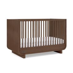 a wooden crib with white sheets on the bottom and side rails, in front of a white background