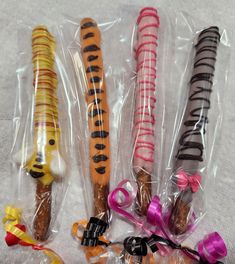 four different types of candy wrapped in plastic