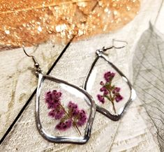 Real pressed Heather flower earrings sealed in resin. Nickel free earring hooks. Resin Drop Earrings With Pressed Flowers, Elegant Pressed Flower Resin Earrings, Cheap Flower-shaped Resin Earrings, Flower Seed Paper, Heather Flower, Unique Flower-shaped Earrings With Pressed Flowers, Flower-shaped Resin Earrings With Pressed Flowers, Botanical Earrings, Nickel Free Earrings