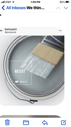 an image of a can of paint with the words water on it and a brush