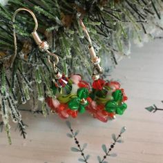 These holiday earrings are made with lampwork beads by an artisan. The earrings are accented with Swarovski crystals. Handmade Christmas Earrings For Celebration, Handmade Christmas Celebration Earrings, Whimsical Beaded Earrings As A Gift, Holiday Multicolor Earrings As Gift, Multicolor Earrings For Holiday Gifts, Holiday Multicolor Earrings As A Gift, Holiday Multicolor Earrings Perfect For Gifts, Czech Glass Beaded Drop Earrings As Gift, Czech Glass Beaded Drop Earrings For Gift