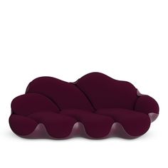 a purple couch sitting on top of a white floor