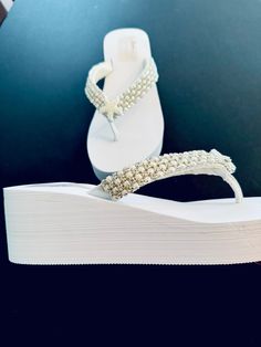 Absolutely Stunning Beaded Rhinestone /Pearl Trim Line these Straps with a Starfish Pearl Rhinestone Button Added for a touch of extra Bling for a Spectacular Wedding Experience! An Inner Layer of Satin underneath added for comfort. Last Photo shows on a flat 1/2 Flip Flop Sandal. Rush Orders Offered https://www.etsy.com/listing/211630967/rush-order?ref=shop_home_active_7&frs=1 Ships Worldwide  Contact Shop Owner 7 Days a Week for Speedy Replies ! Elegant Bling Sandals For Wedding, Elegant Wedding Sandals With Bling, Glamorous Bedazzled Wedding Sandals, Bedazzled Open Toe Wedding Sandals, Bedazzled Open Toe Sandals For Wedding, Elegant White Beaded Sandals, White Pearl Wedding Shoes For Bridal Shower, Elegant Adjustable White Wedding Shoes, Elegant White Adjustable Wedding Shoes