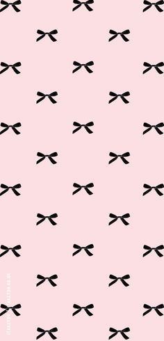 a pink background with black bows on it