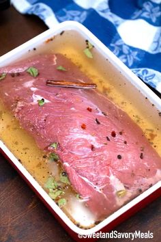 raw meat in a pan on a wooden table