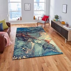 a living room with wood flooring and large rug on the floor in front of two windows