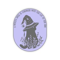 a purple sticker with a dog wearing a hat and holding a spider in it's mouth