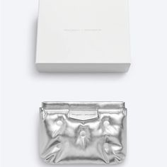 Maison Margiela X Gentle Monster Cushion Clutch Bag In Metallic Silver Faux Leather. New And Unused, Authentic. Part Of A Collaboration With Gentle Monster. Has A Self Closing Mechanism. Includes Original Box. Measures 7” Inches Tall X 8 3/4” Inches Wide. Luxury Pouch Clutch With Silver-tone Hardware, Luxury Silver Clutch With Removable Pouch, Luxury White Clutch Pouch, Margiela Bag, Bag Belt, Gentle Monster, Martin Margiela, Metallic Silver, Clutch Bag