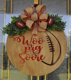 a wooden sign with a football on it