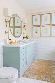 a bathroom with blue cabinets and white walls