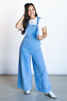 Experience effortless style and comfort with our Easy Choice Wide Leg Overall Jumpsuit! This trendy and versatile piece features adjustable straps with knots for a perfect fit and large pockets. You can keep it simple with a white tee underneath or add some fun with a puff sleeve floral. We recommend getting your true size. Ally is 5'5 and is wearing a size small Hand Wash Cold Hang to Dry 100% Cotton Overalls With Pockets For Day Out, Solid Overalls With Pockets For Day Out, Casual Cotton Jumpsuits And Rompers With Tie Straps, Casual Solid Jumpsuits And Rompers With Adjustable Straps, Casual Jumpsuits And Rompers With Adjustable Straps, Casual Cotton Overalls With Tie Straps, Spring Casual Jumpsuits And Rompers With Adjustable Straps, Casual Jumpsuits And Rompers With Adjustable Straps For Spring, Casual Spring Jumpsuits And Rompers With Adjustable Straps