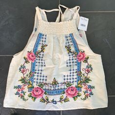 Free People Sleeveless Top With Embroidered Floral Design. New With Tags. Summer Embroidered Cotton Tank Top, Summer Cotton Embroidered Tank Top, Embroidered Cotton Tank Top For Beach, Floral Embroidered Tank Top For Spring, Embroidered Tank Top For Summer, Spring Floral Embroidery Tank Top, Casual Beige Embroidered Summer Top, Embroidered Beach Tank Top For Spring, Floral Embroidered Tank Top For Summer