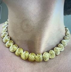 Tiffany & Co. spiral swirl necklace in 18K yellow gold. Stamped 1990 750 Tiffany & Co. 16 inches in length and 0.60 inches wide. Swirl Necklace, Tiffany & Co., Precious Metals, Swirl, Yellow Gold, Yellow, Gold