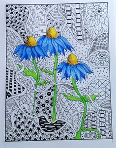 two blue flowers are in front of an intricate background with black and white designs on it