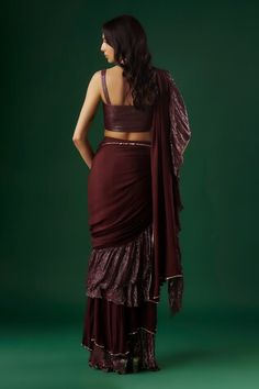 Wine tiered-textured pre-draped ruffle saree with placed sequin embellishments. Comes with padded textured blouse. - Aza Fashions Fitted Ruffled Saree, Fitted Draped Sharara With Pallu, Fitted Bollywood Dress With Draped Sleeves, Elegant Fitted Choli With Ruffles, Evening Ruffled Dress For Diwali, Festive Draped Choli With Ruffles, Designer Ruffled Fitted Blouse, Festive Draped Ruffle Choli, Festive Draped Ruffles Choli