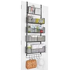 the door is open to reveal an organized pantry area with shelves and baskets on it